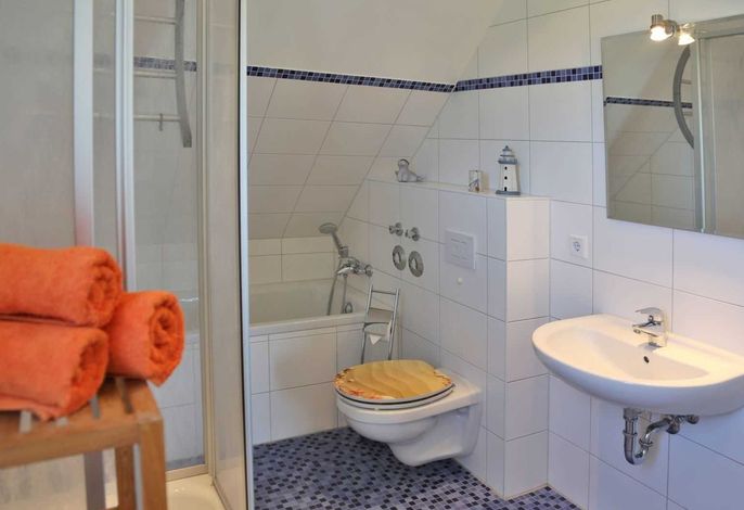 Photo Strandapartment – Meerblick trifft knisterndes Kaminfeuer 2