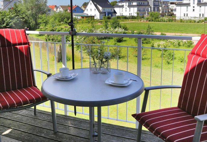 Photo Strandapartment – Meerblick trifft knisterndes Kaminfeuer 6