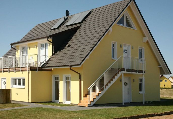 Photo Strandapartment – Meerblick trifft knisterndes Kaminfeuer 4