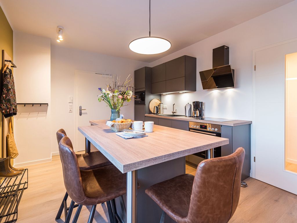Peter’s Lodge Grömitz: Wohnbereich einer Ferienwohnung