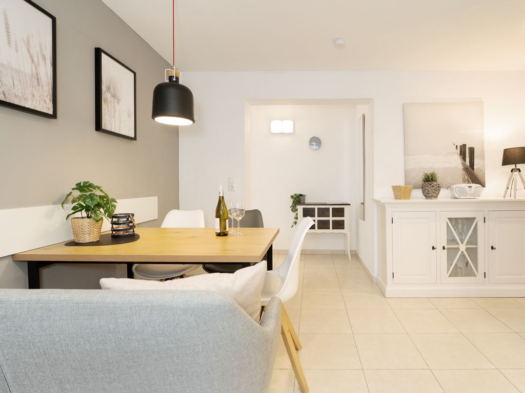 Haus Strandgeflüster Grömitz: Wohnbereich einer Ferienwohnung