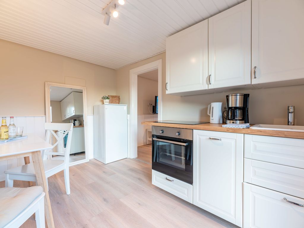 Landhaus am Meer Utersum: Wohnbereich einer Ferienwohnung
