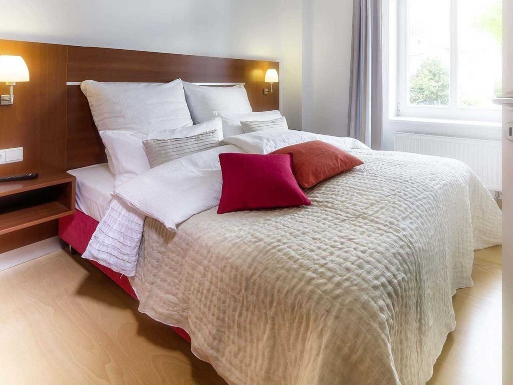 Villa Aesculap Binz – Essplatz und Küche einer Ferienwohnung
