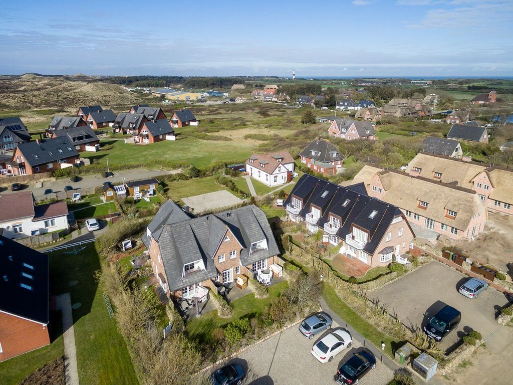 Achter Dünem Wenningstedt auf Sylt – Wohnbereich mit Sofa