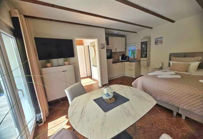 Photo Idyllisches kleines Ferienhaus am Hochufer von Lohme 7