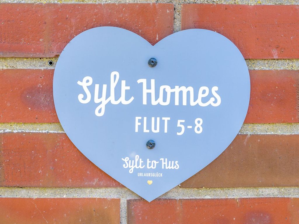 Sylt Homes Westerland: rotes Friesenhaus mit Garten
