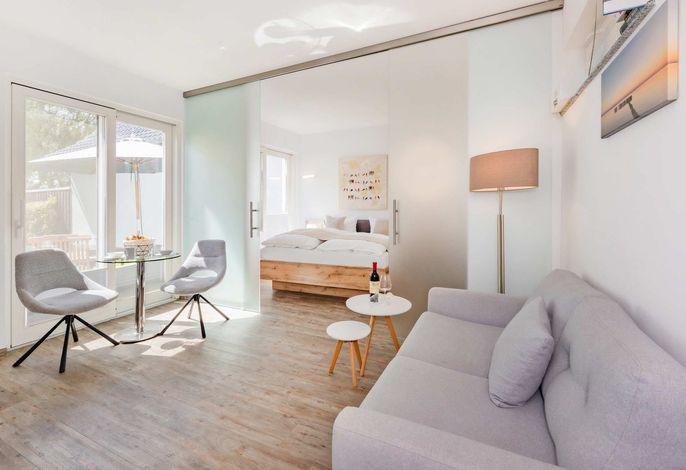 Gemütliche Ferienwohnung mit Terrasse & Haffblick – ruhige Lage am See