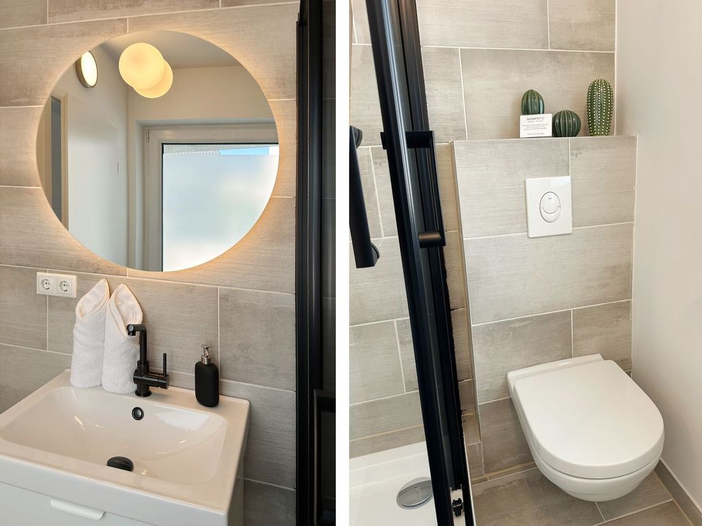 Sauberes und modernes Badezimmer mit Fenster