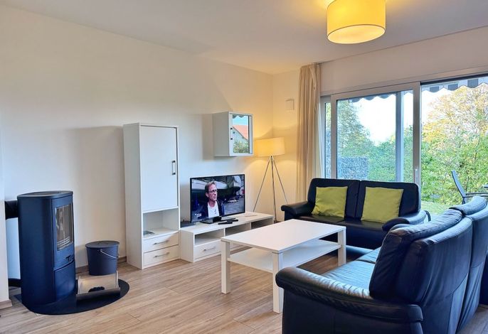 Photo Moderne Erdgeschosswohnung mit 3 Schlafzimmern und Kamin 1