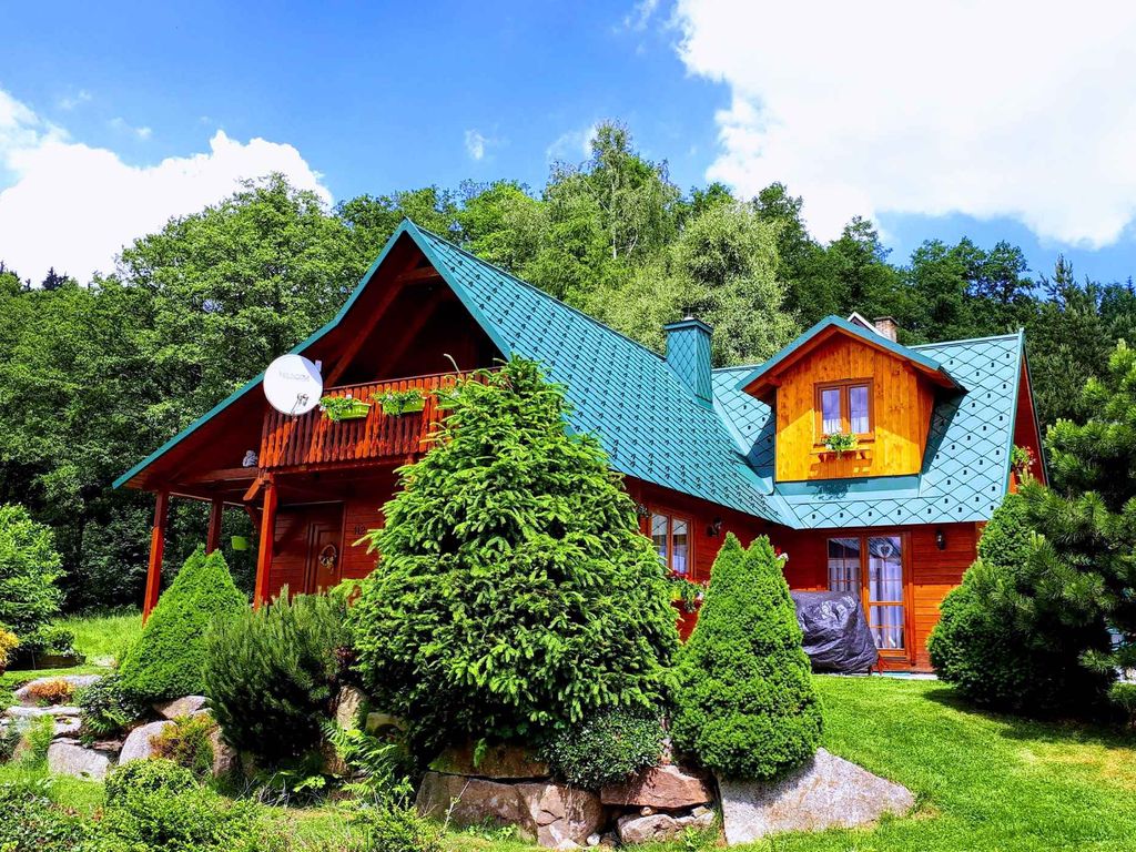 Ferienhaus mit Kamin und Sauna bei Wald