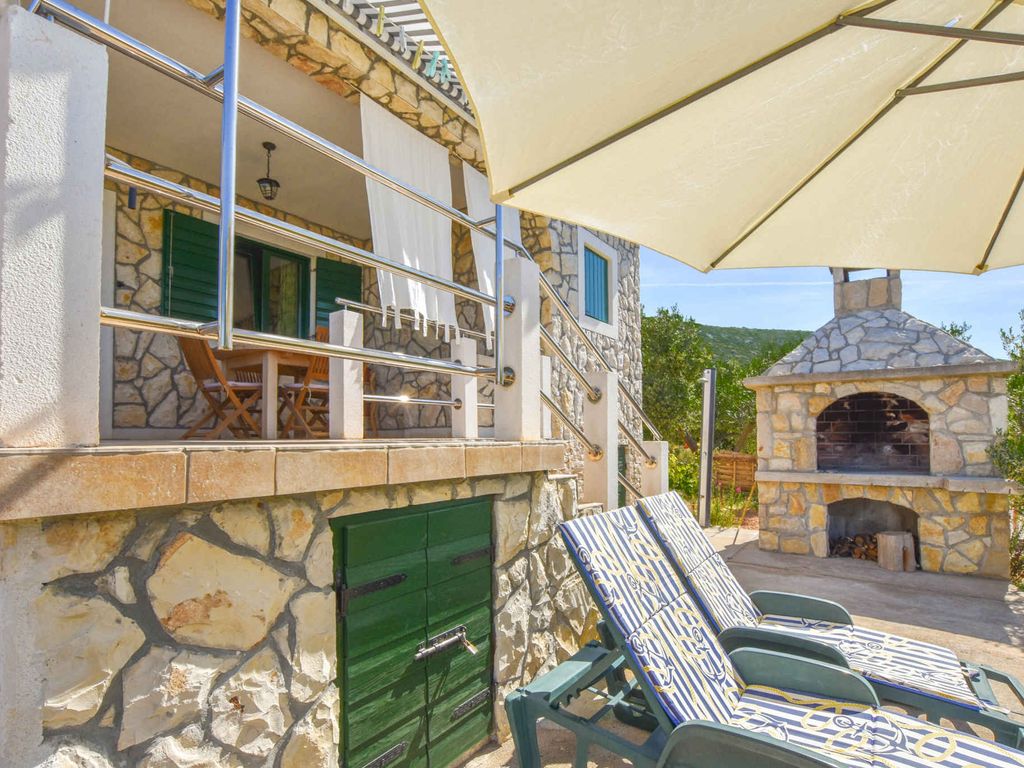 Ferienhaus mit Balkon, Grillmöglichkeit und Meerblick