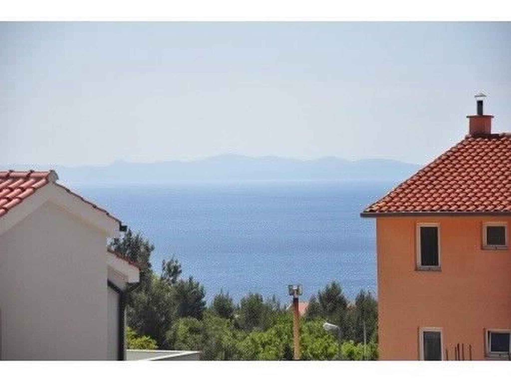 Ferienwohnung mit Pool und Meerblick