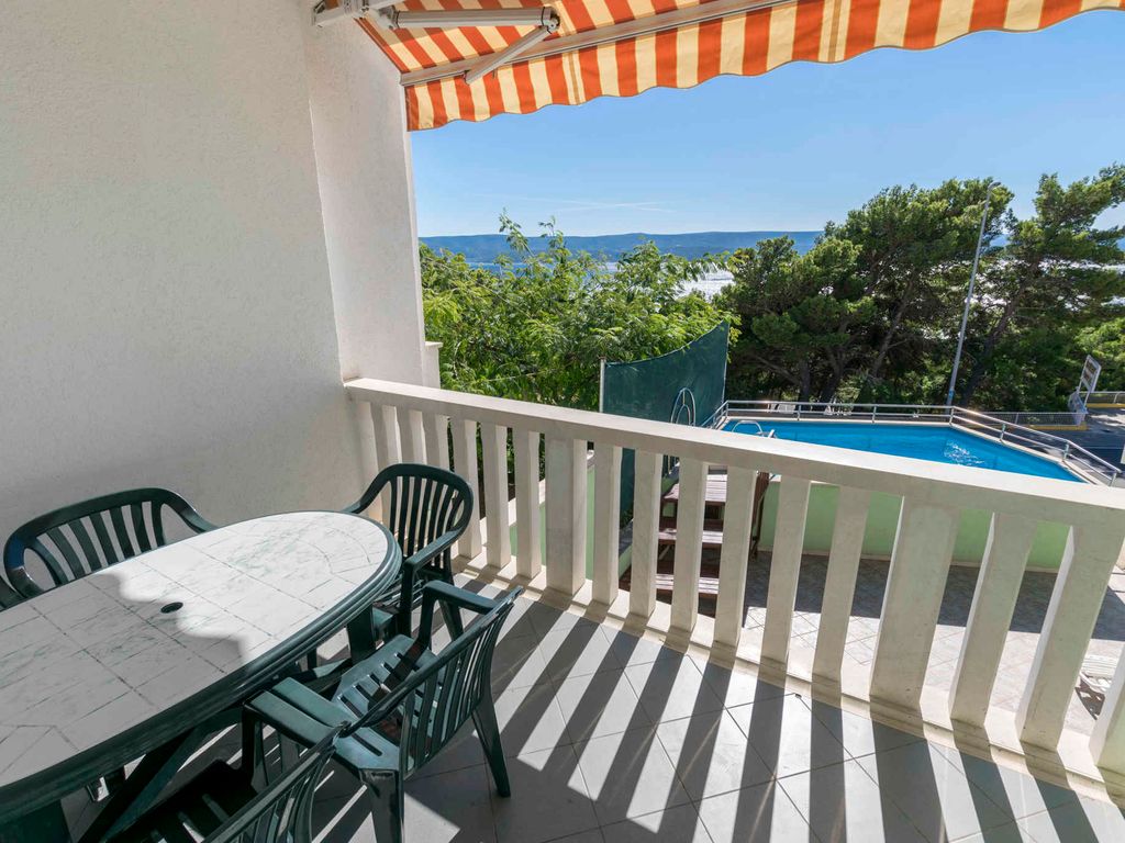 Ferienwohnung mit Gemeinschaftspool und Balkon