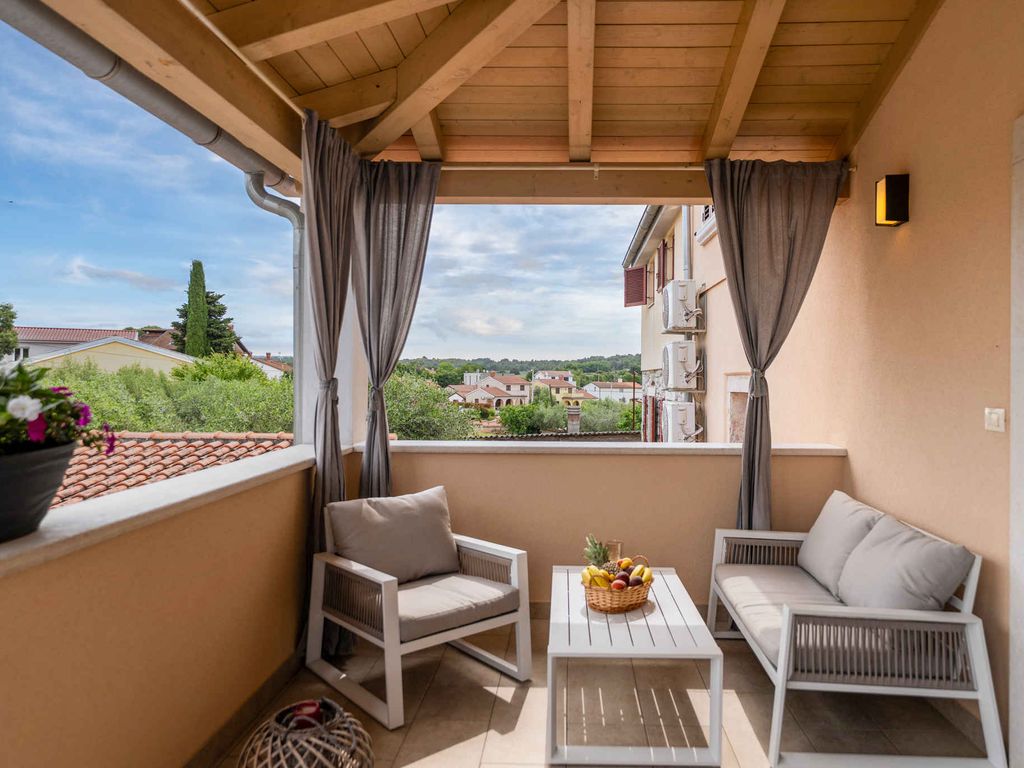 Ferienwohnung mit überdachter Balkon und privatem Innenhof