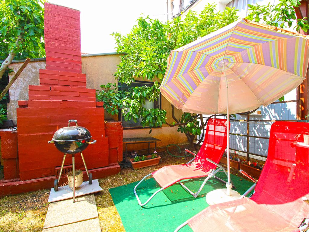 Ferienwohnung mit Klima und gedeckter Terrasse