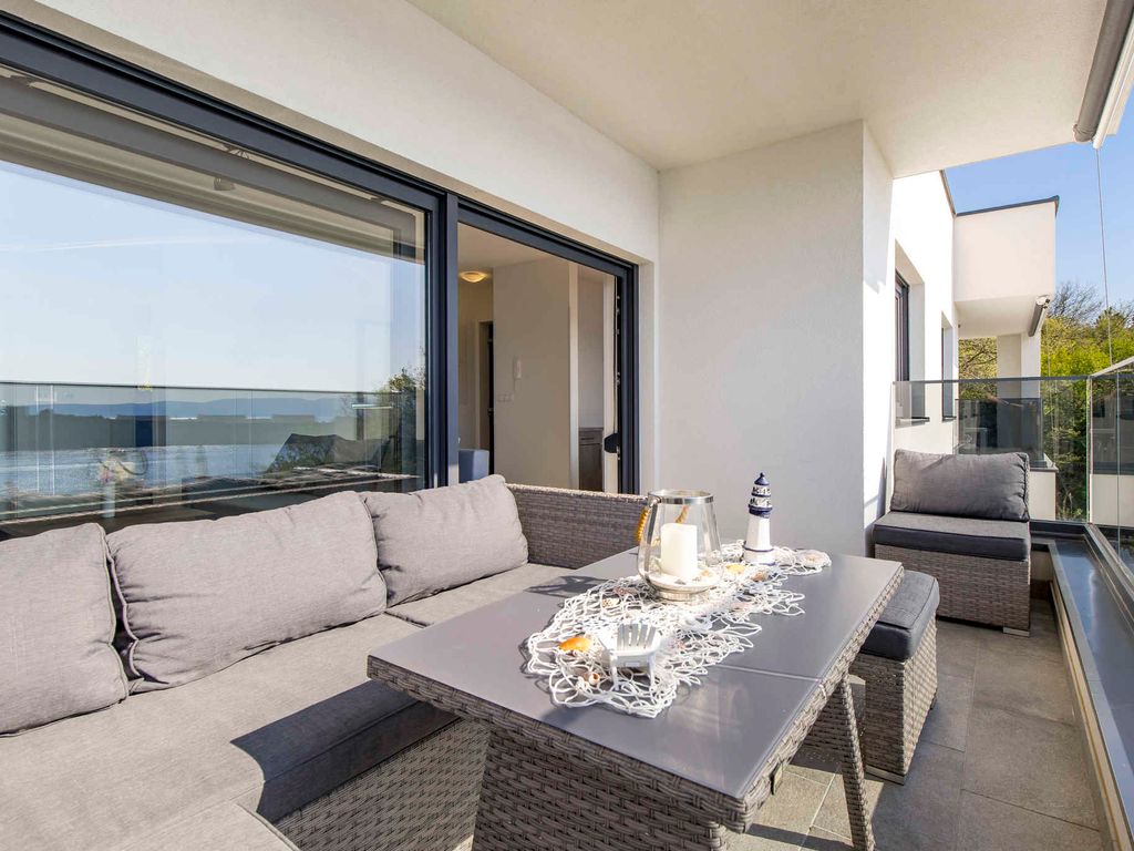 Ferienwohnung mit Garten, Balkon und Meerblick