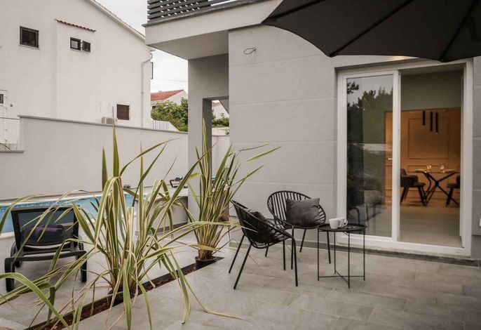 Ferienwohnung mit Swimmingpool und Grill zur gemeinsamen Nutzung