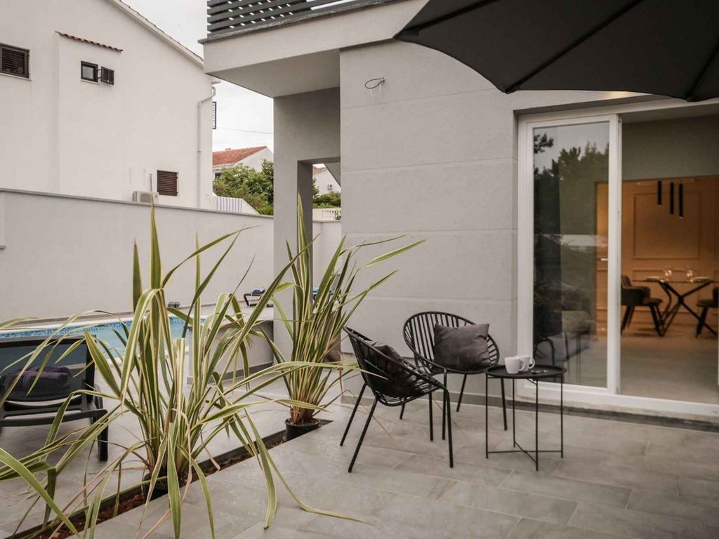 Ferienwohnung mit Swimmingpool und Grill zur gemeinsamen Nutzung