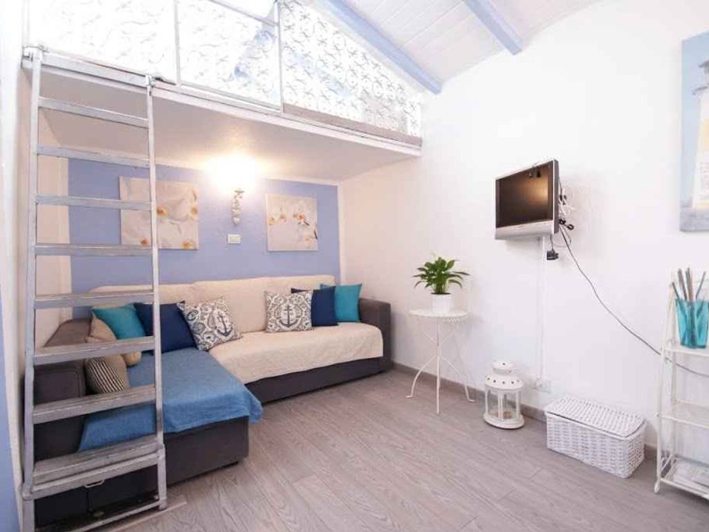 Ferienwohnung mit Klimaanlage und Dachterrasse mit Meerblick