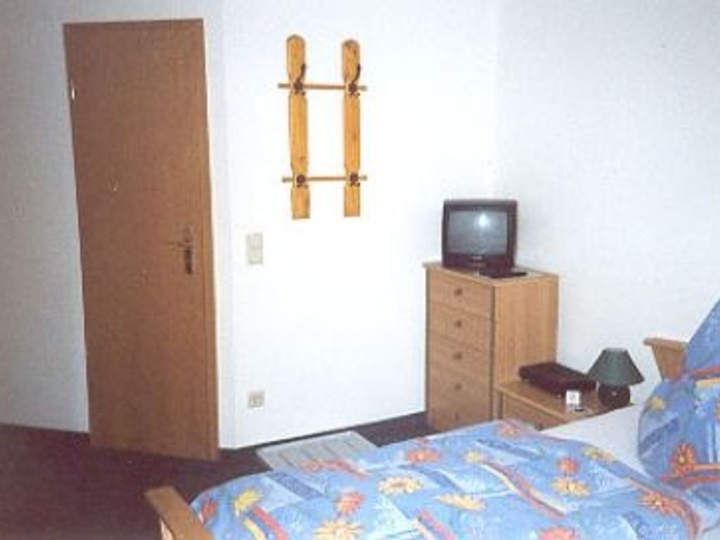 double bedroom with extra bed