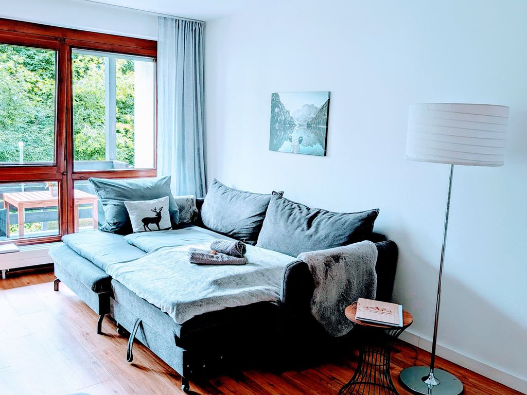 Wohnzimmer mit Schlafsofa