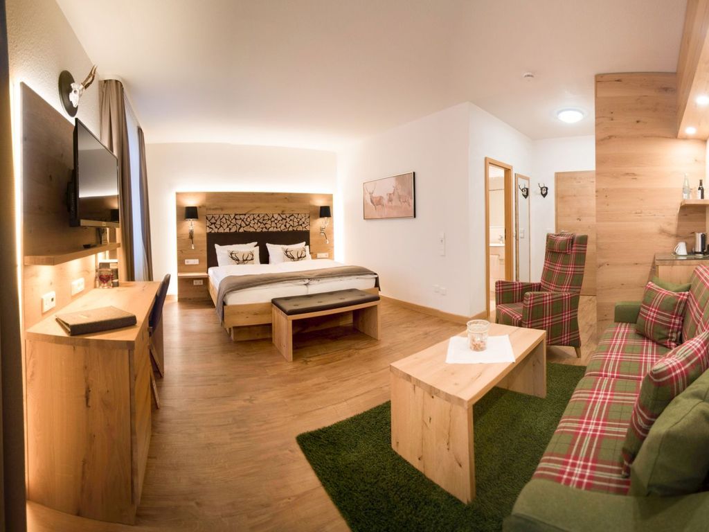 Wald-Flair Juniorsuite mit Holzboden