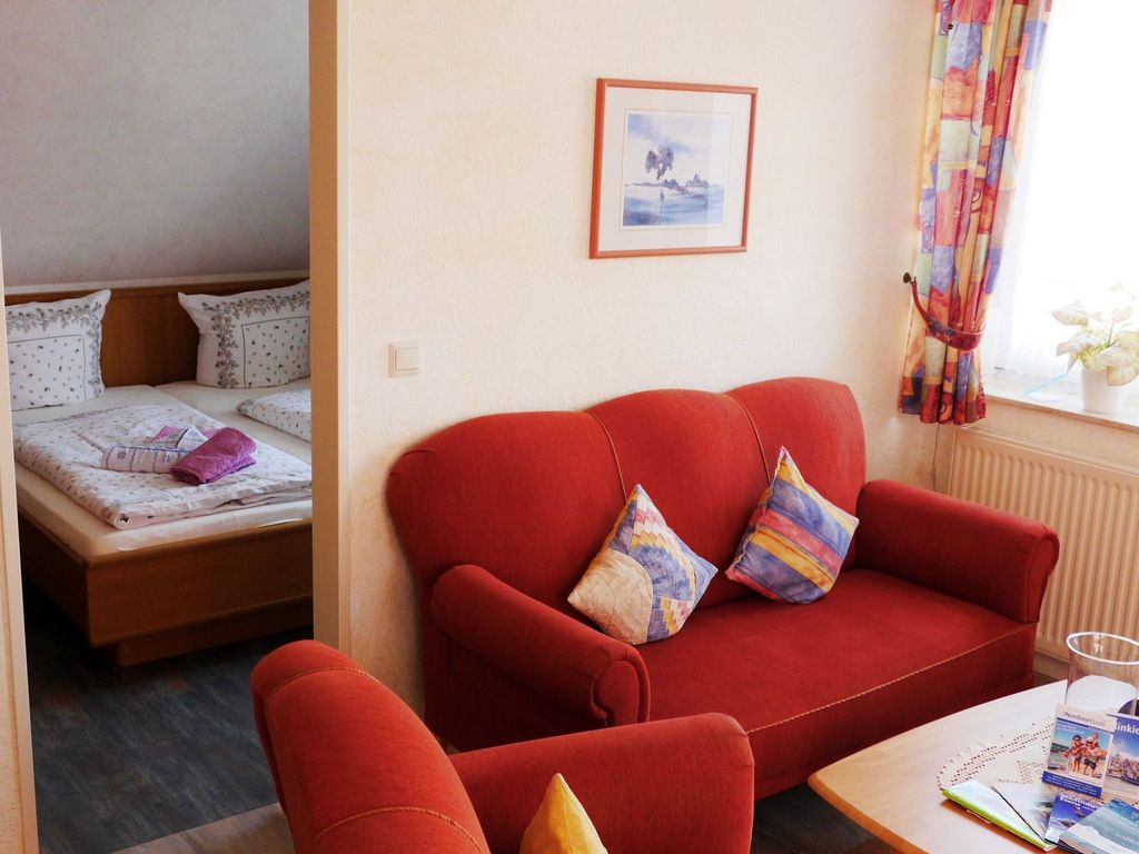Living room with view into the bedroom
