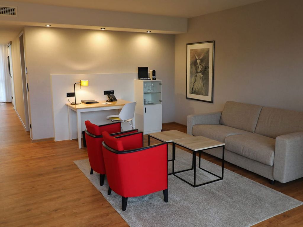 Wohnzimmer in der Suite im Naundrups Hof Hotel in Lüdinghausen