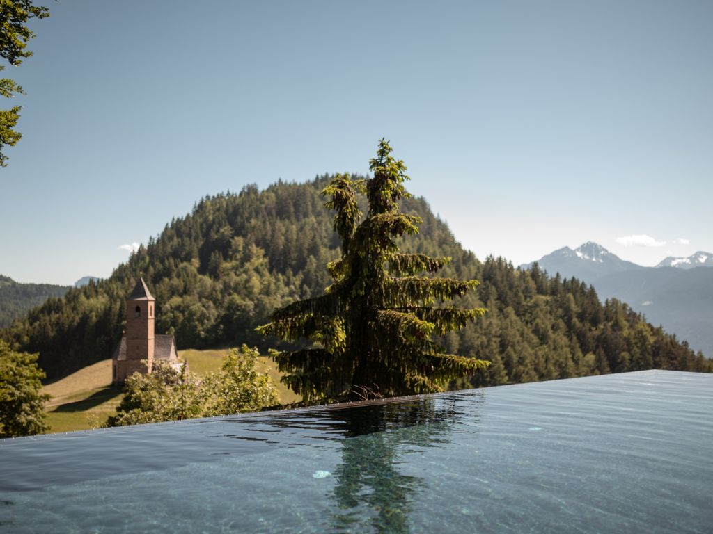 Infinity Pool with St. Kathrein Church
