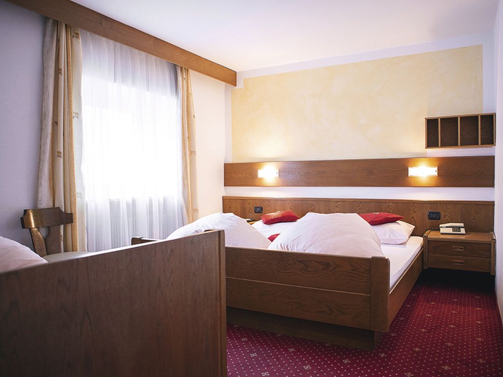 Dreibettzimmer im Rider Hotel Obereggen