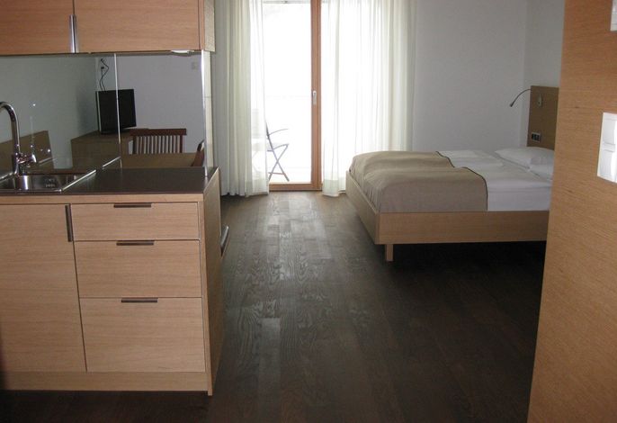 Gartenzimmer mit Balkon