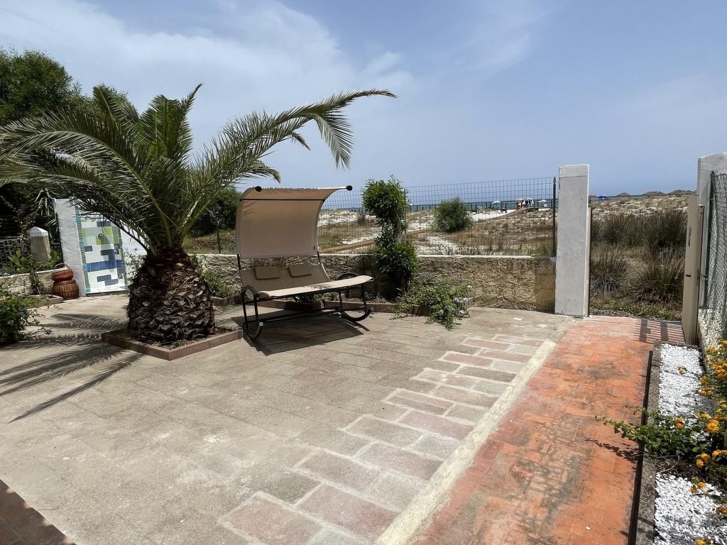 Haus in La Caletta mit Garten und Grill