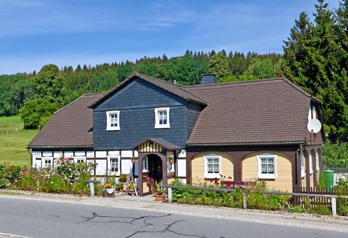 Ferienwohnung mit Sitzecke im Freien