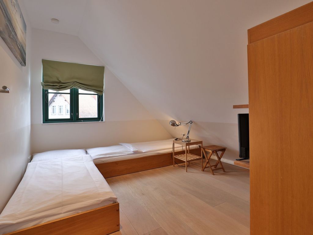 Traveblick - Blick in das kleine Schlafzimmer mit 2 Einzelbetten