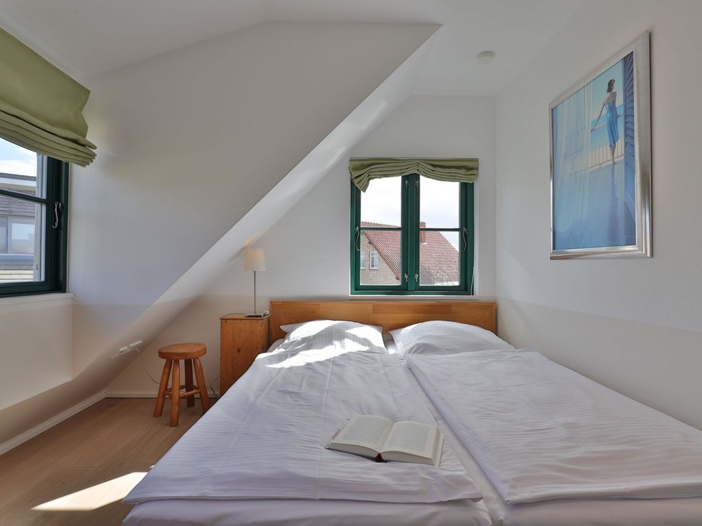 Traveblick - Blick in das Schlafzimmer mit einem Doppelbett