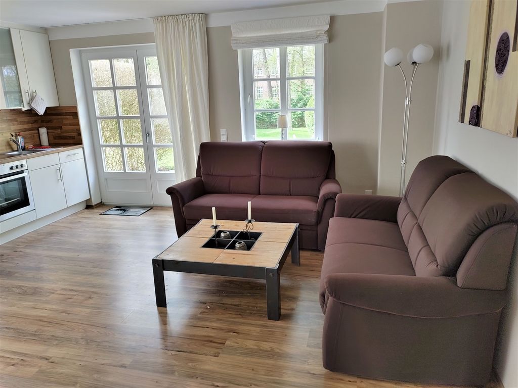 Wohnzimmer mit Zugang zur Terrasse