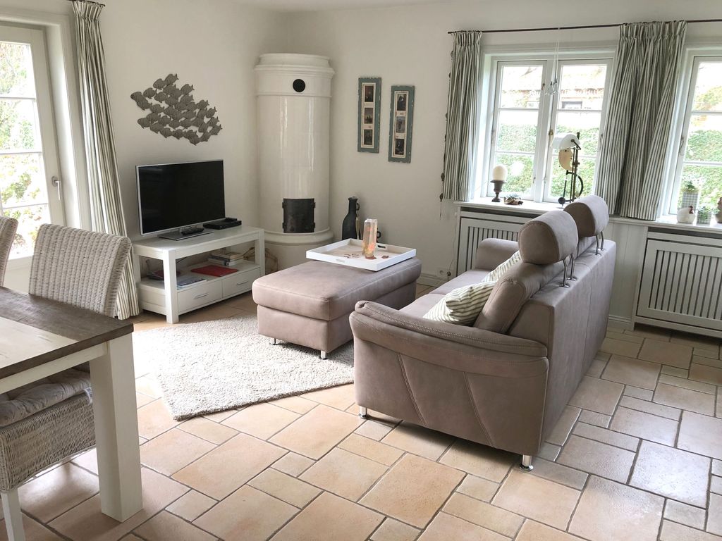 Wohnzimmer mit Zugang zur Terrasse