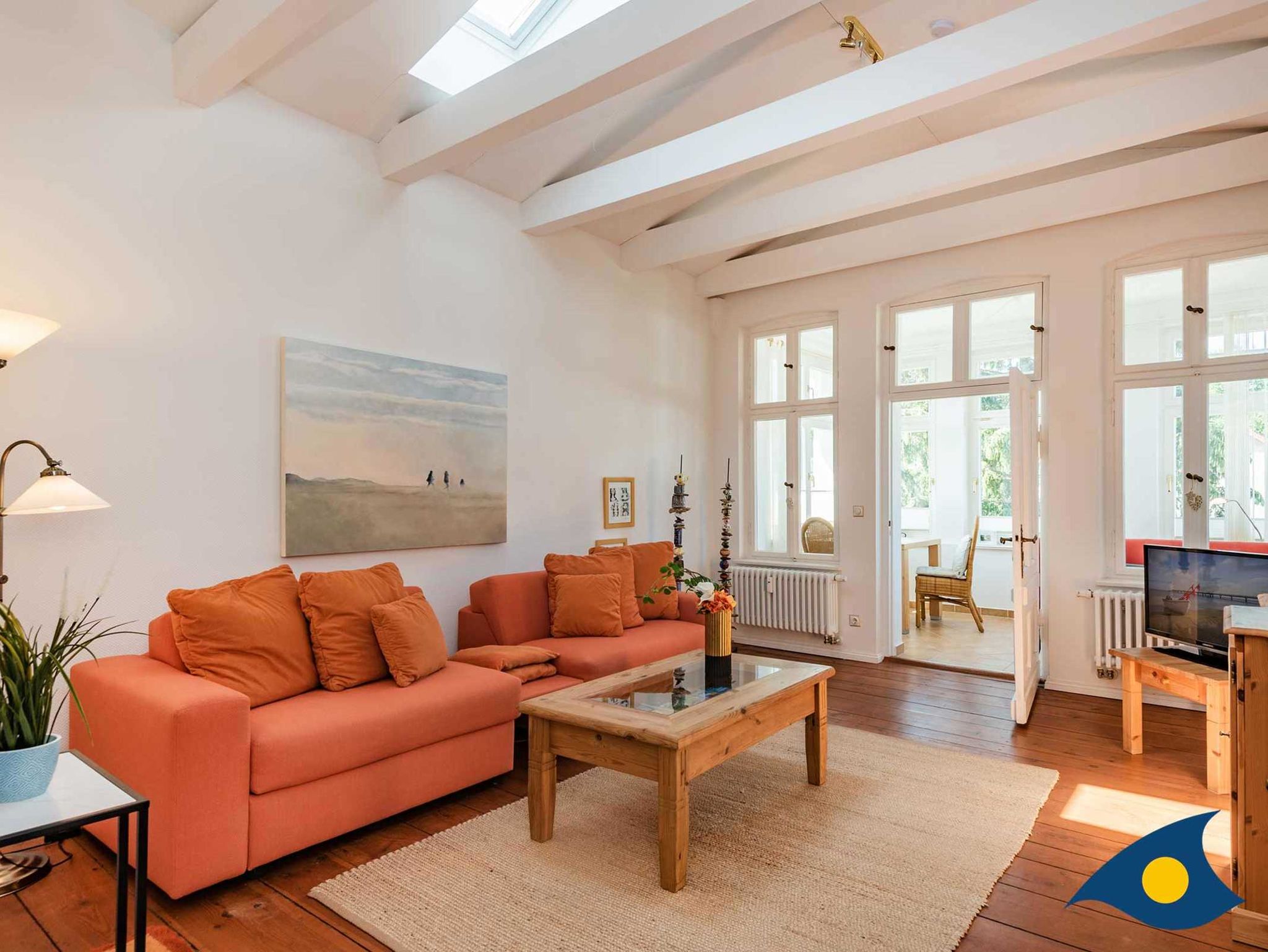 Wohnzimmer mit Zugang zur Verranda und Terrasse
