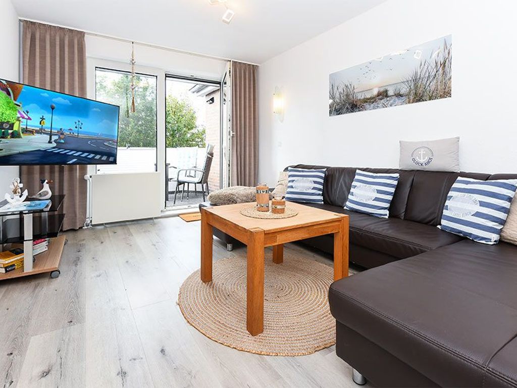 Wohnzimmer mit integriertem Küchenbereich
