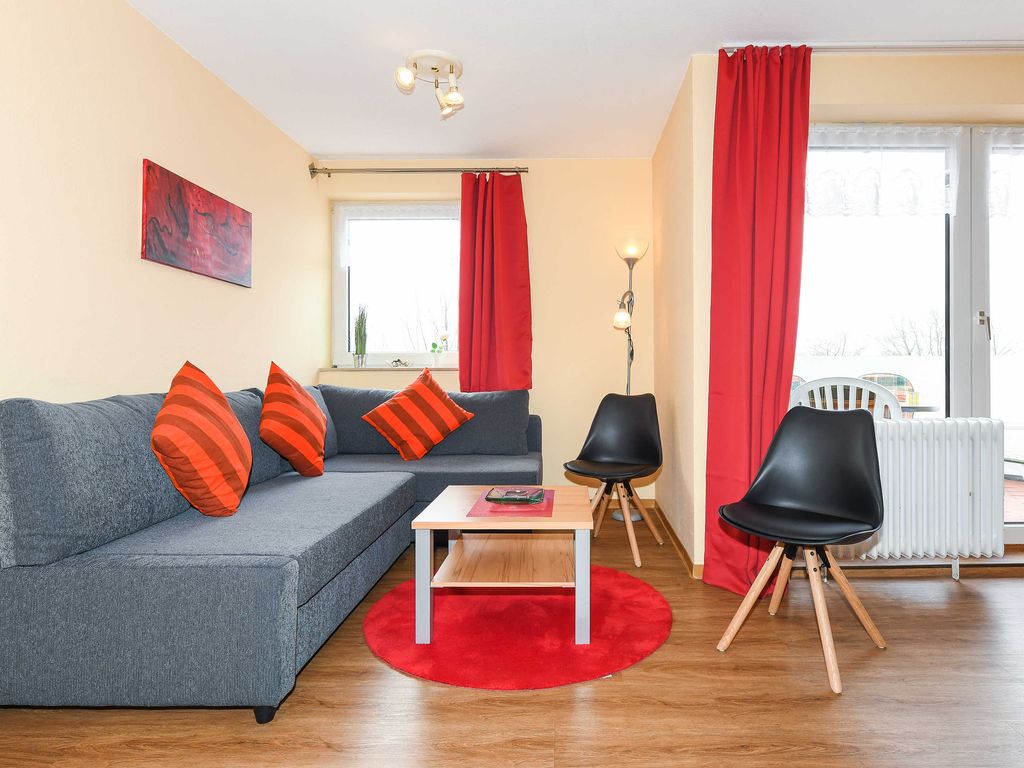 Wohnzimmer mit integriertem Küchenbereich