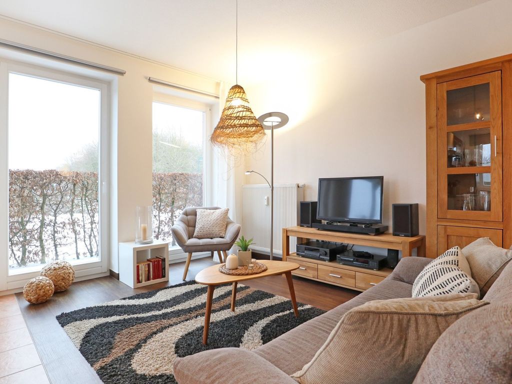 Kastanienhof Whg. 01 - Blick auf den gemütlichen Wohnbereich mit TV