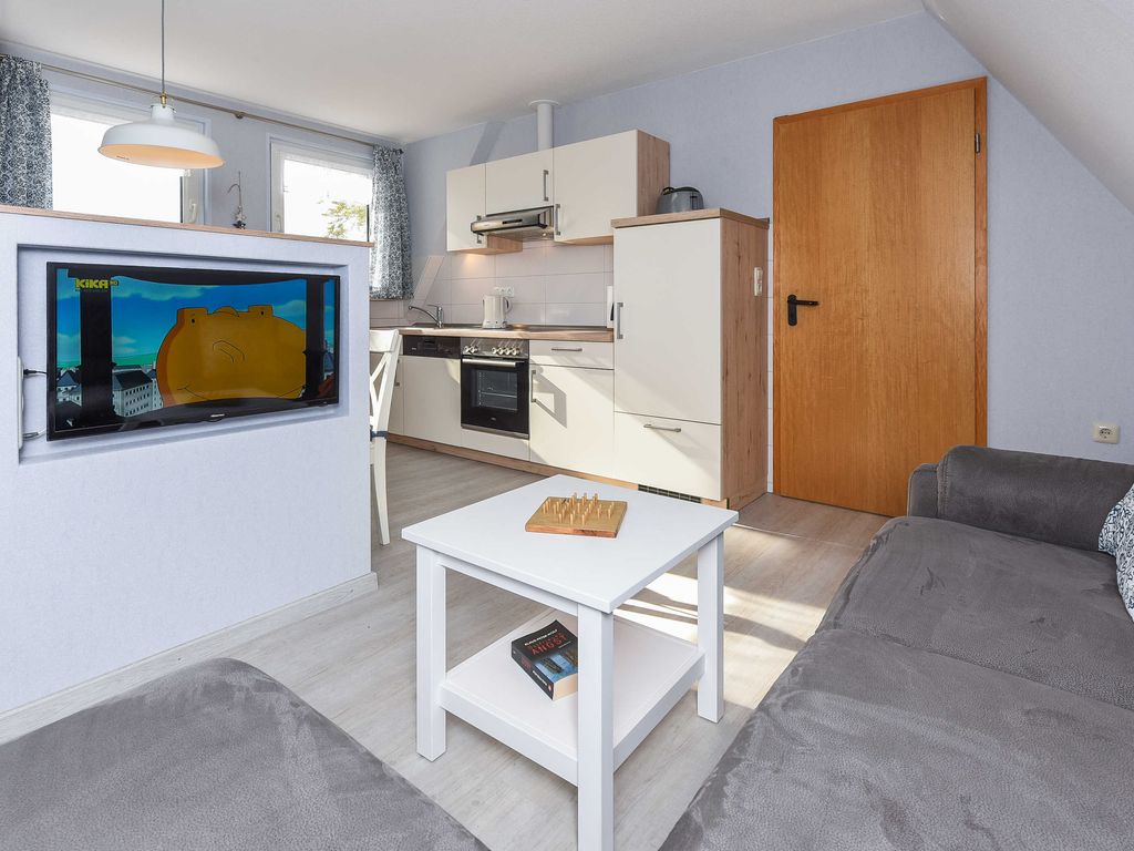 Wohnzimmer mit integriertem Küchenbereich