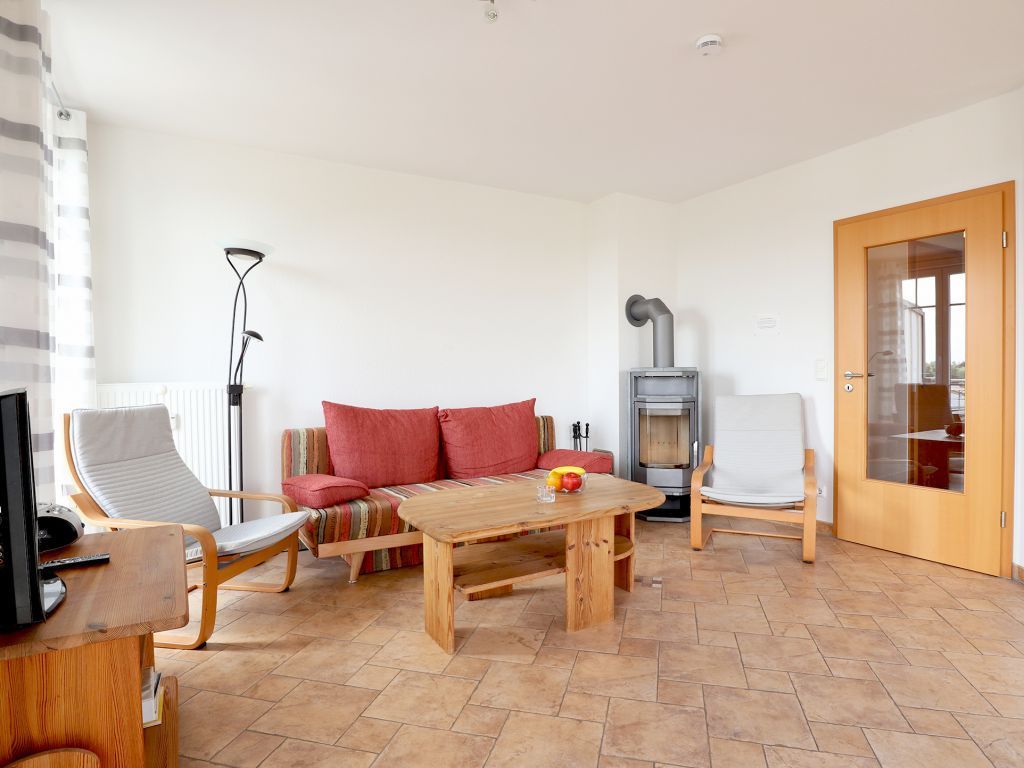 Achtern Diek App. 27- gemütlicher Wohnbereich mit Kamin