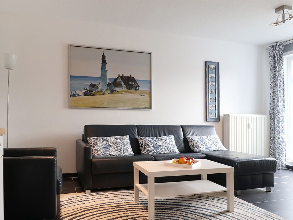 Residenz Haffblick App.12- Wohnbereich mit gemütlichem Sofa