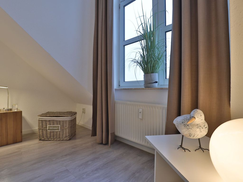 Sünnslag App.13/59 - Blick in das Schlafzimmer mit einem Doppelbett