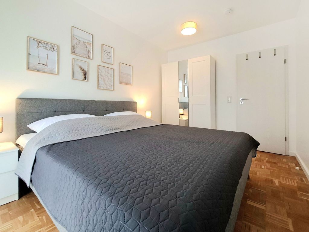 Haffblick Whg.21- Blick in das gemütlichen Schlafzimmer mit Boxspringbett