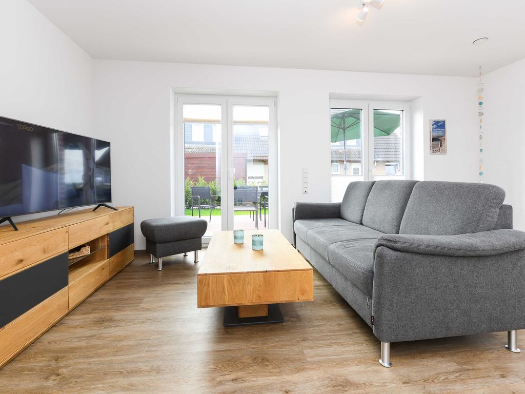 Wohnzimmer mit integriertem Küchenbereich