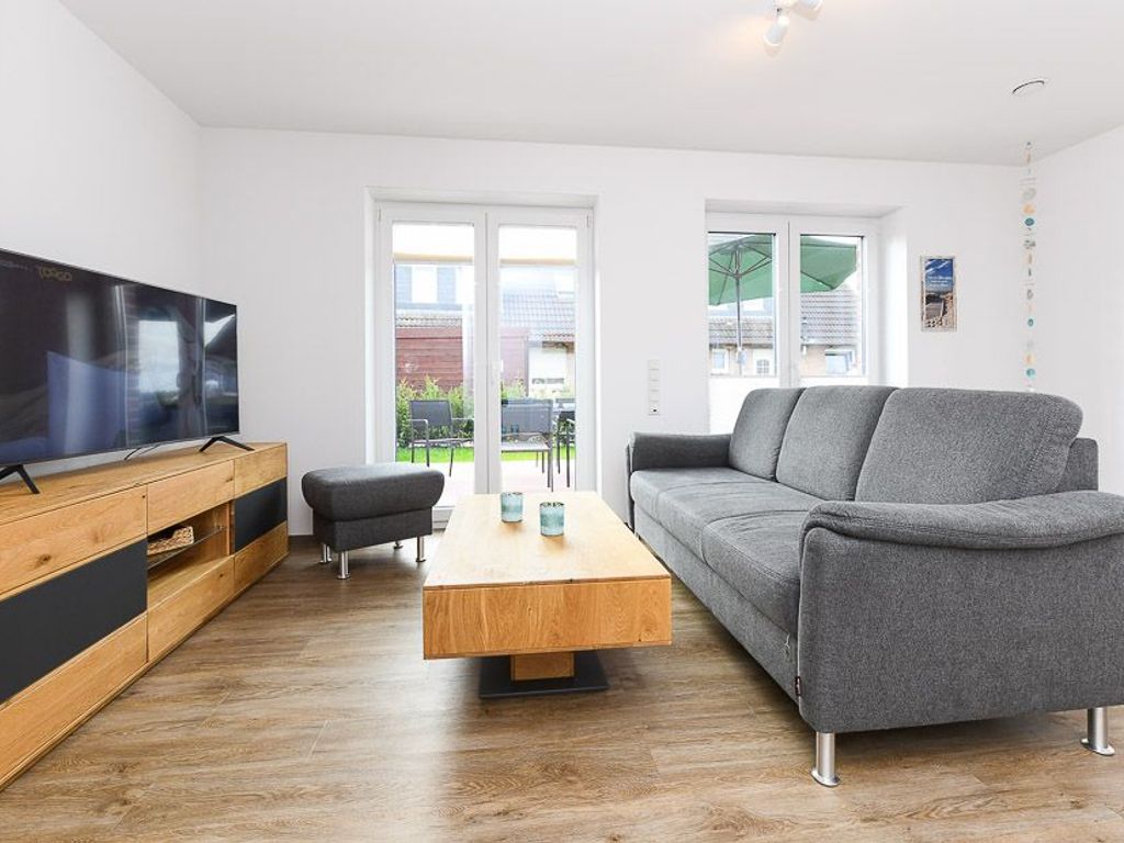 Wohnzimmer mit integriertem Küchenbereich