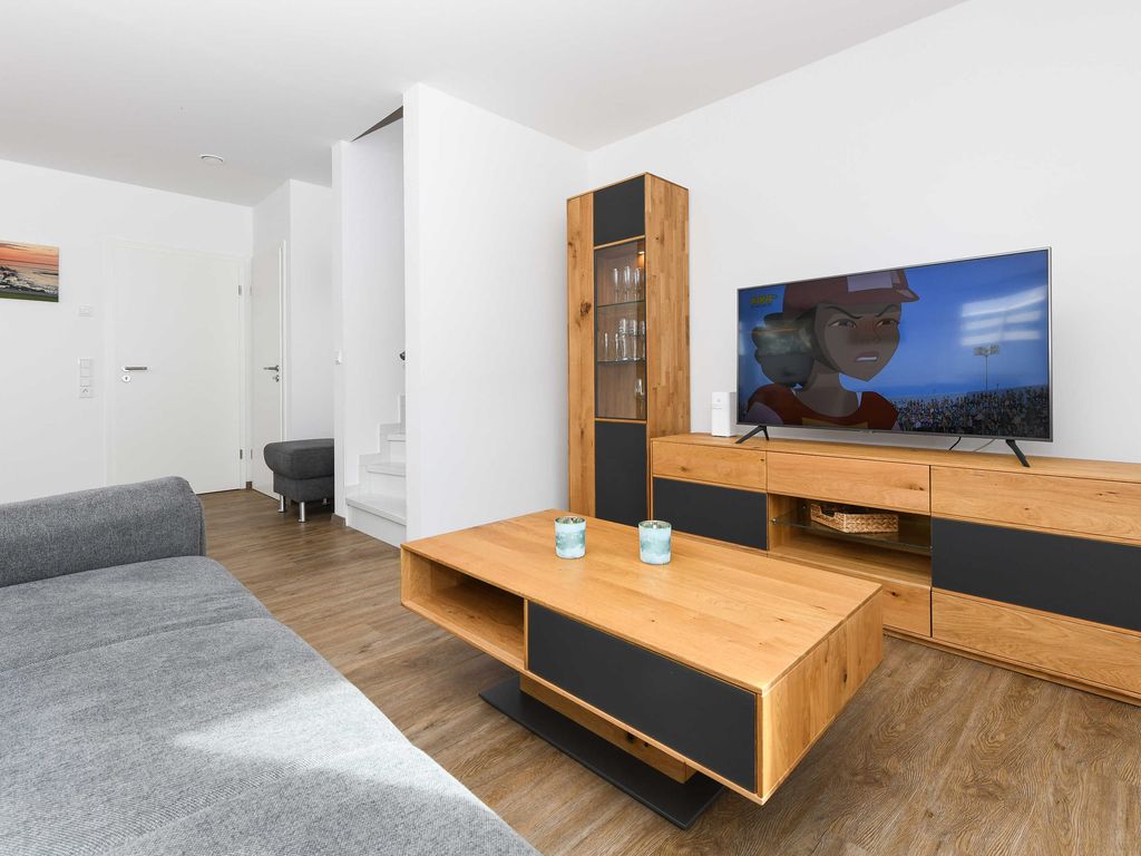 Wohnzimmer mit integriertem Küchenbereich