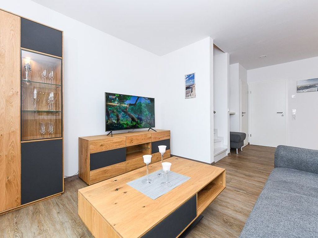 Wohnzimmer mit integriertem Küchenbereich